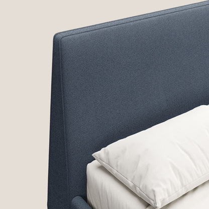 Dorotea letto imbottito con piedi in legno in morbido bouclé impermeabile T07 blu 